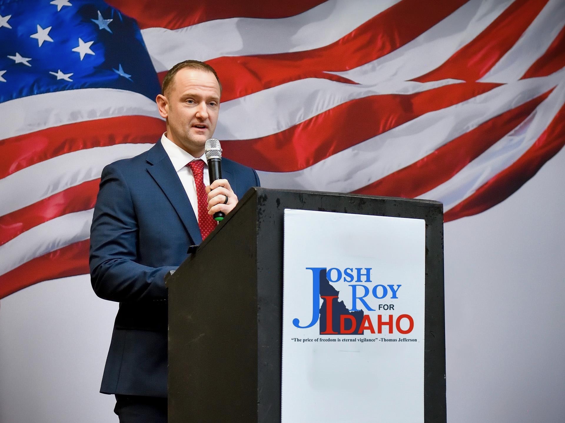 Josh Roy speaking at podium